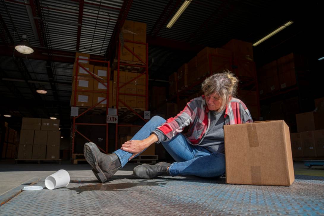 A person sitting on the floor with her foot in the air
AI-generated content may be incorrect.